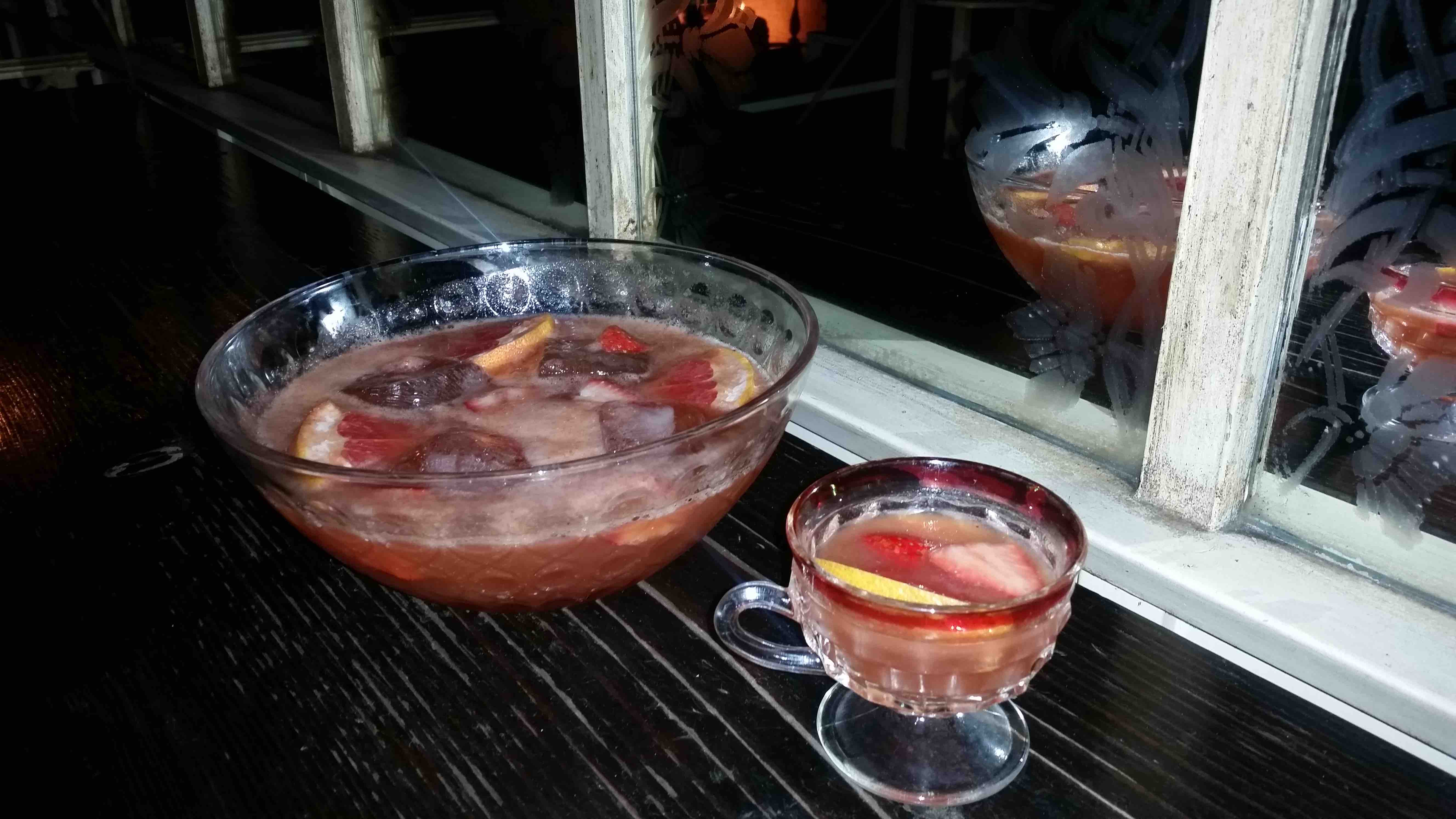 The Jitterbug Perfume Punch from Los Angeles' Caña Rum Bar combines jasmine-infused Bulleit rye whiskey, Smith and Cross Navy Strength rum, Coruba Dark rum, Montenegro amaro, Luxardo Abano amaro, honey syrup, fresh grapefruit and lime juices, and strawberries.