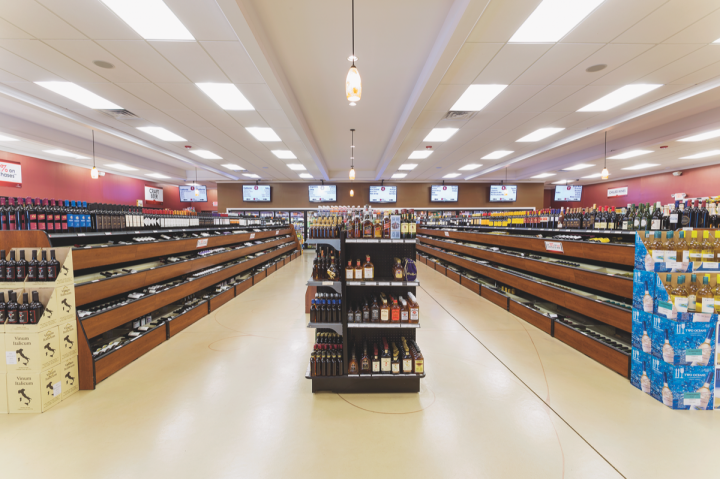 Wine Chateau stores feature wide aisles, bright lighting and LCD screens, resulting in a modern, welcoming interior.