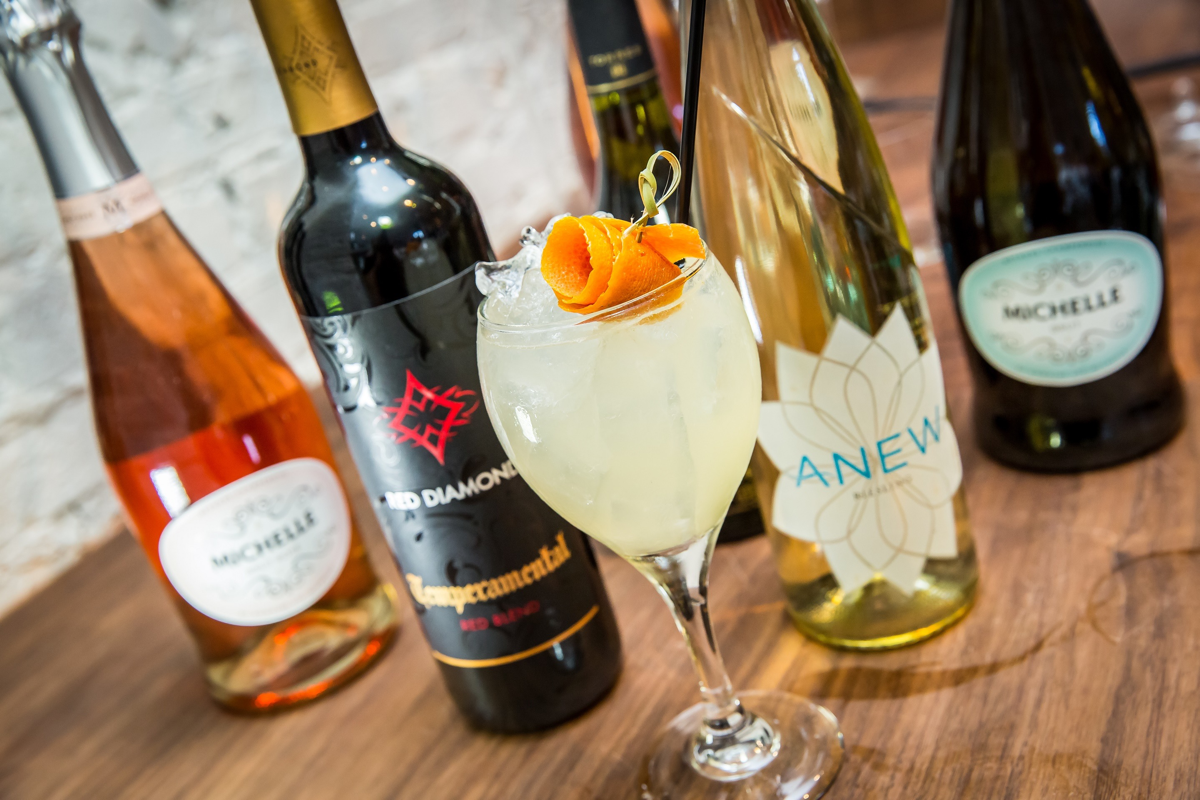 Wine brings out unexpected cocktail flavors. The Summer Dress blends Chardonnay with pear vodka, aloe liqueur, grapefruit and lemon juice.