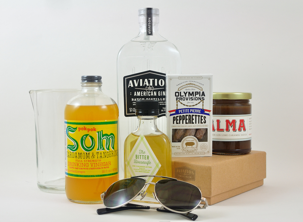 The Project 10 lineup features a mixing glass from Bull in China, drinking vinegar from Pok Pok, bitters from The Bitter Housewife, sunglasses from Shwood, sausages from Olympia Provisions and caramel sauce from Alma.