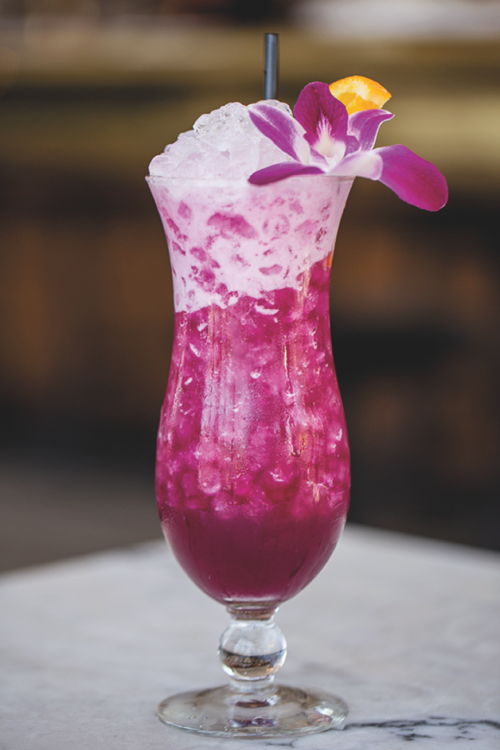 The Purple Haze at Polite Provisions in San Diego blends bright citrus flavors with floral aromas for a colorful summer libation.