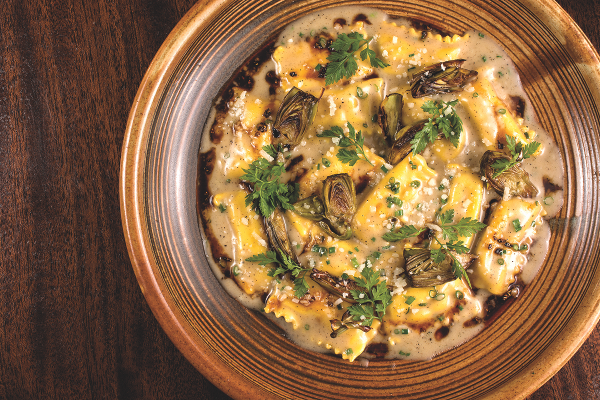At The Dutch restaurant and oyster room, dishes like artichoke ravioli (pictured) and burgers are served.