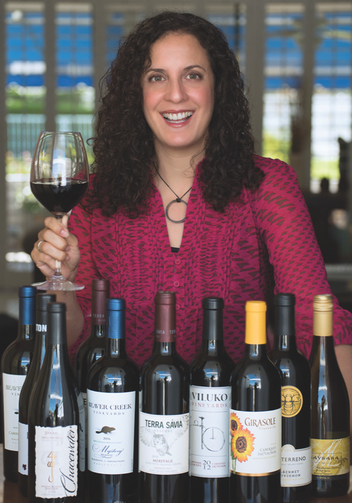 Organic Wine Exchange founder Ann Arnold (above with a selection of her site's offerings) curates a comprehensive online portfolio of certified organic wines sourced from across the globe.