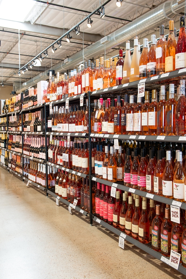 Twin Liquors takes special care to promote local products. Earlier this year, the store hosted an event where Texas rosés were tasted alongside worldwide rosés (rosé shelf above).