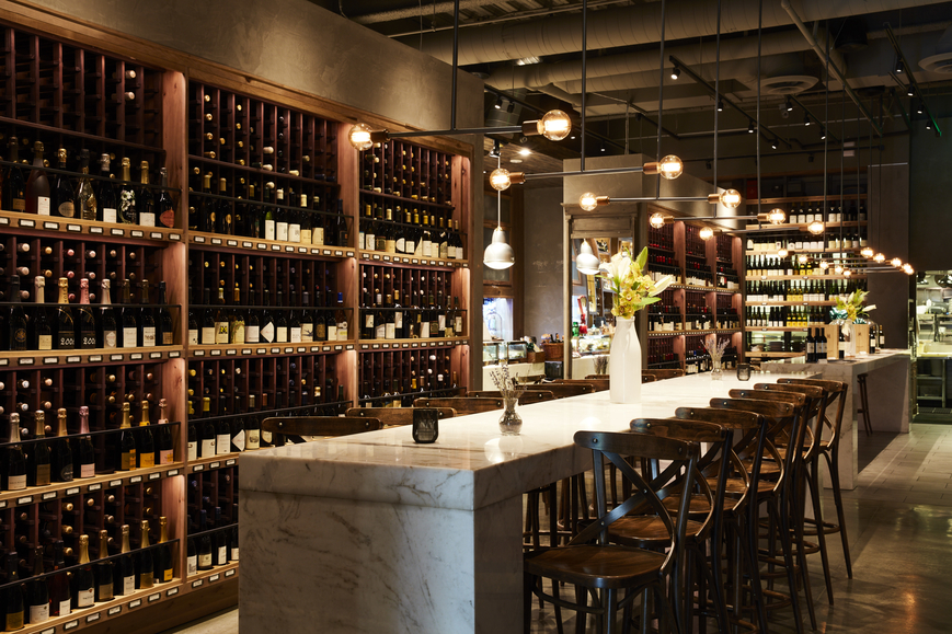 Wally’s Wine & Spirits (spirits shelf  at Beverly Hills location top) prides itself on making clients feel at home when they visit, which is why the company is working toward implementing personalized online chats for its website. 