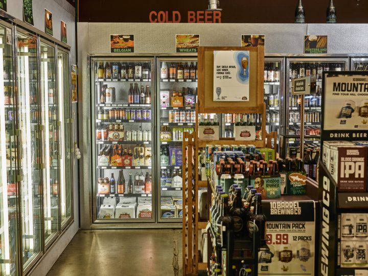 Downtown Spirits (beer coolers pictured) focuses its beer selection on local craft products, with top-sellers including Black Raven Updraft pale ale and Deschutes Fresh Squeezed IPA.