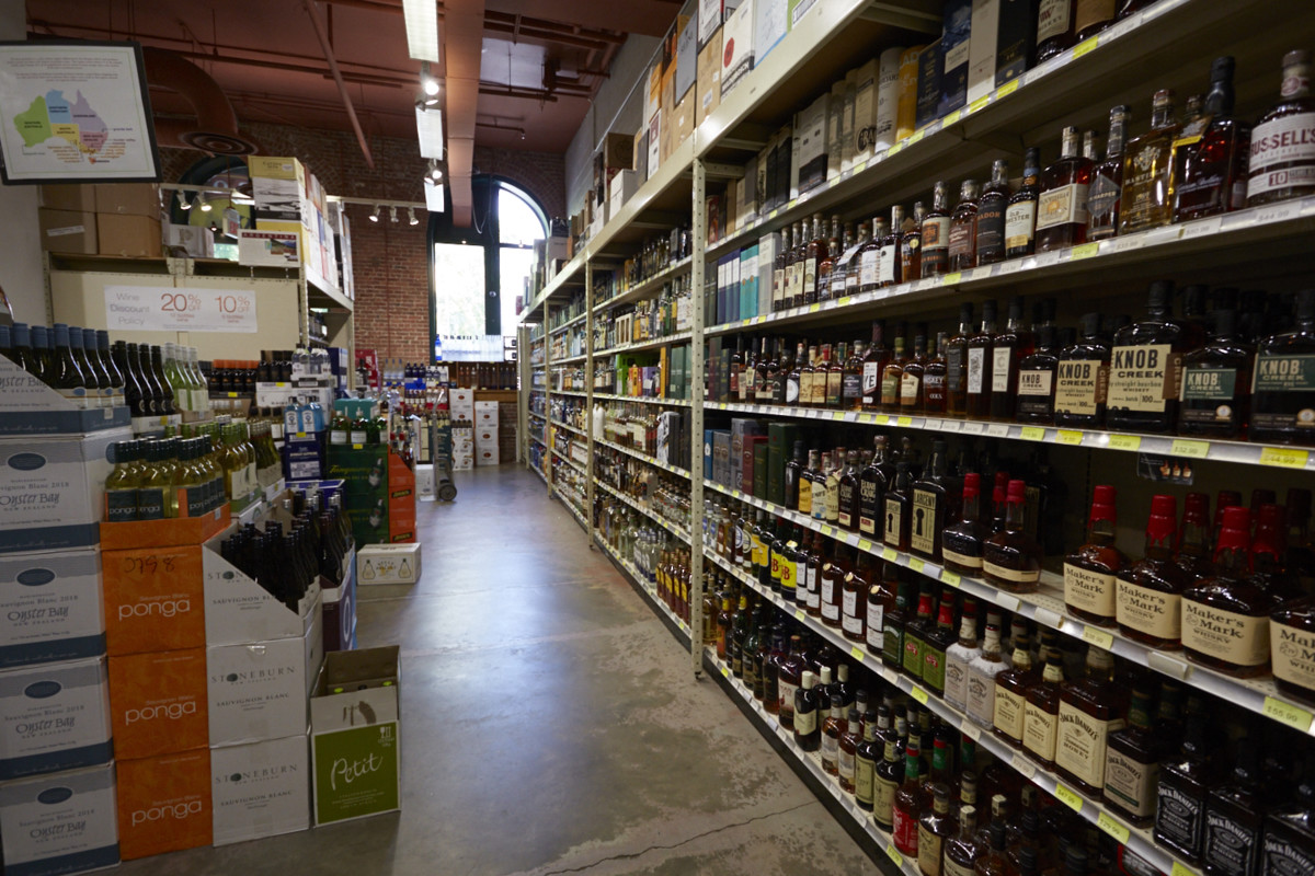 Luis refuses to stock low-end beverage alcohol at Sparrow (shelves pictured) so he can ensure an upscale clientele. 