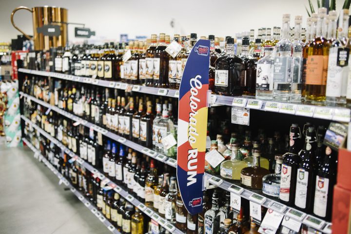 Spirits (shelves pictured) make up roughly a third of sales at Molly's, with local Colorado spirits particularly popular among customers.