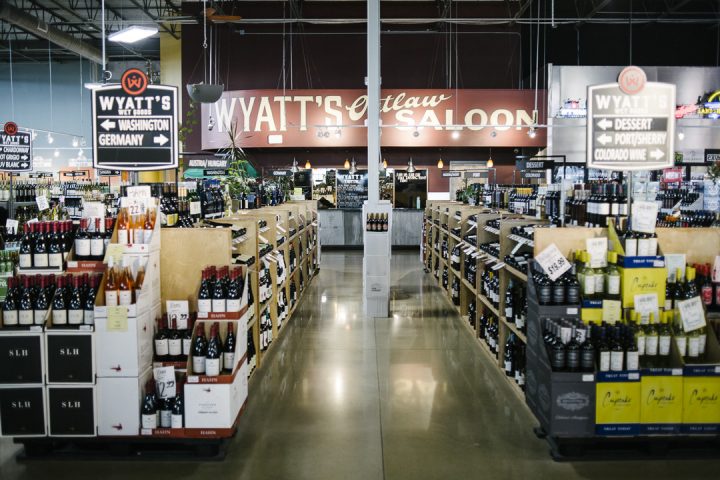 Wyatt’s (interior pictured) features polished concrete floors and high ceilings, as well as natural wood touches, antique decor, and several potted plants. (Photo by Matt Nager)