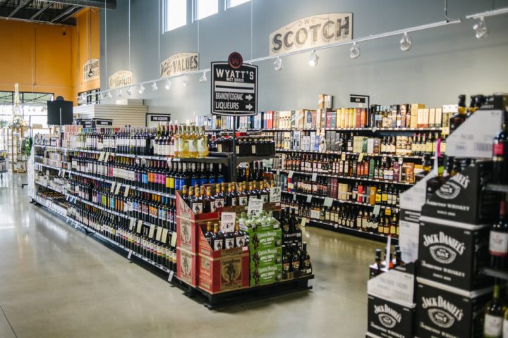 Colorado craft whiskey is a strong and growing category at Wyatt’s Wet Goods (spirits shelves pictured). Dinsmore says Colorado spirits overall are popular with customers. (Photo by Matt Nager)