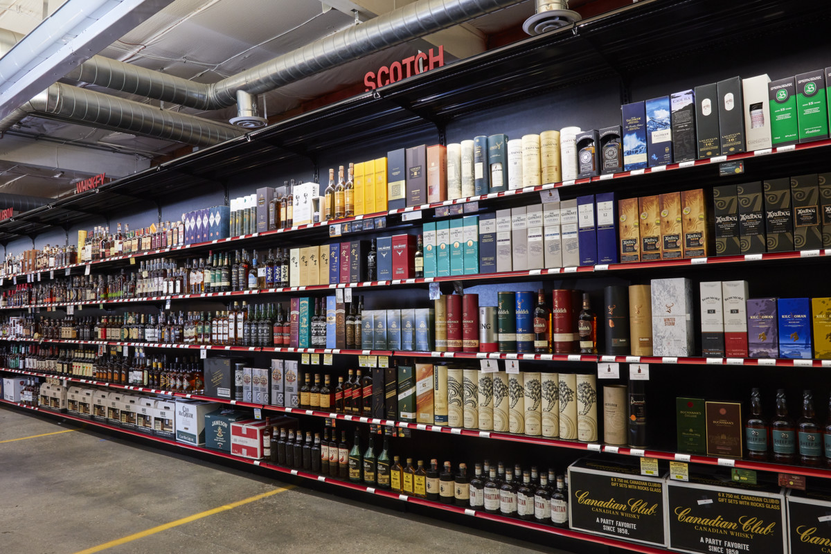 Downtown Spirits offers about 2,500 different spirits (shelves pictured) and has partnered with brands like Woodford Reserve, Eagle Rare, and Buffalo Trace on exclusive single-barrel offerings.