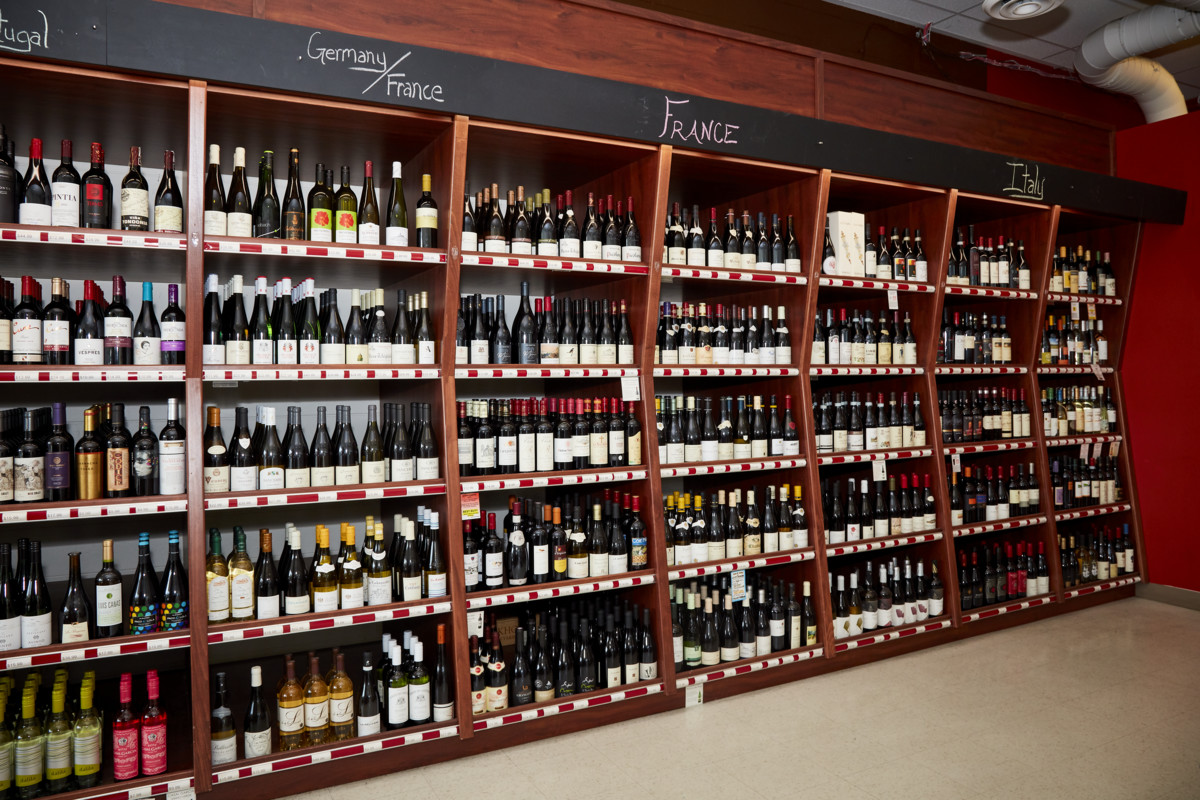 Downtown Spirits (wine shelves pictured) offers approximately 1,000 wine SKUs, with Washington Cabernet Sauvignons among the top sellers.