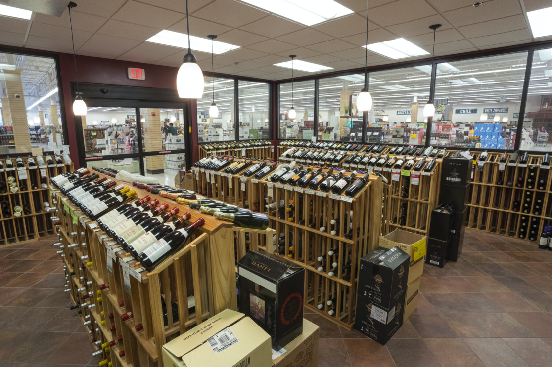Exit 9 (wine room pictured) offers approximately 4,800 wine SKUs, and customers can try wine samples seven days a week at the Wine Attic tasting station.