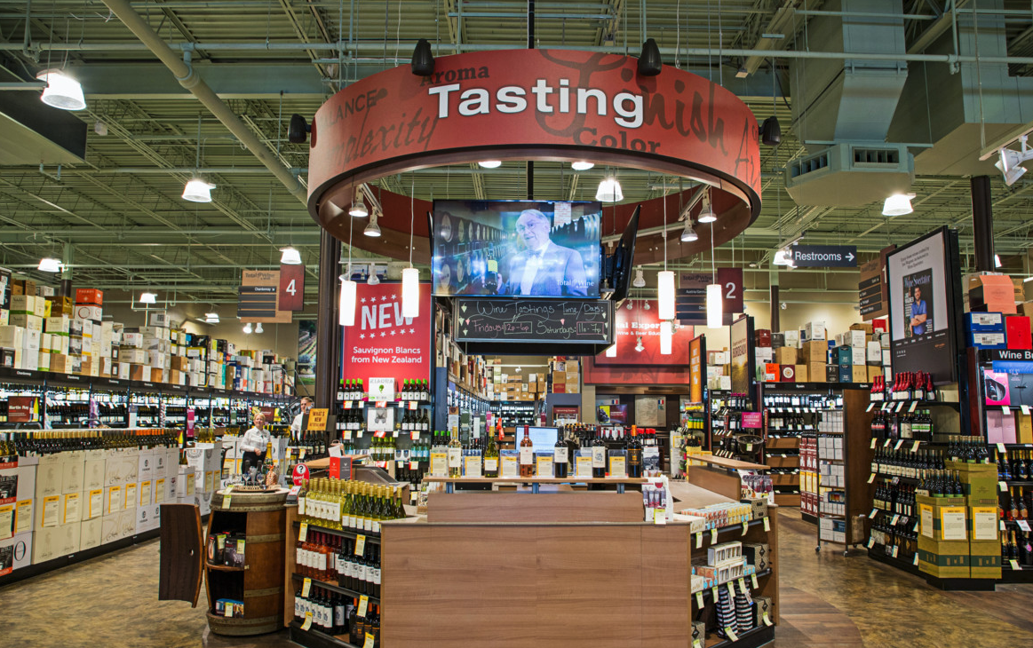 Wine (tasting station pictured) accounts for 45% of sales at Total Wine & More.