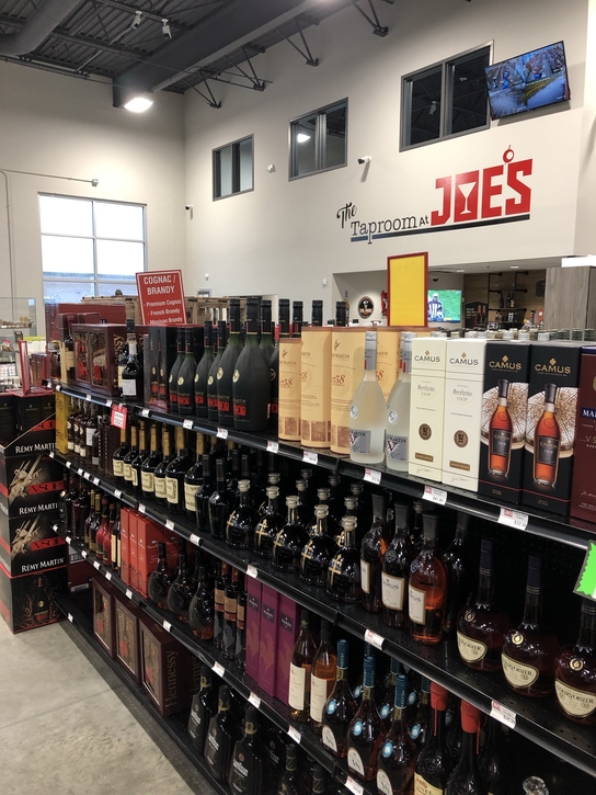 At Joe’s Beverage Warehouse (shelves pictured) in Illinois, Cognac’s popularity is growing, with brands like D’Ussé gaining ground on category stalwart Hennessy.