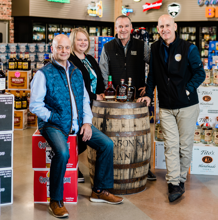 Left to right: Cap n’ Cork vice president and secretary Joe Doust, Jr., marketing director Rachel Burkholder, beer buyer Brent Parker, and president Andrew Lebamoff are seeing overall success in Fort Wayne; sales rose 4% in 2018 to $28 million.
