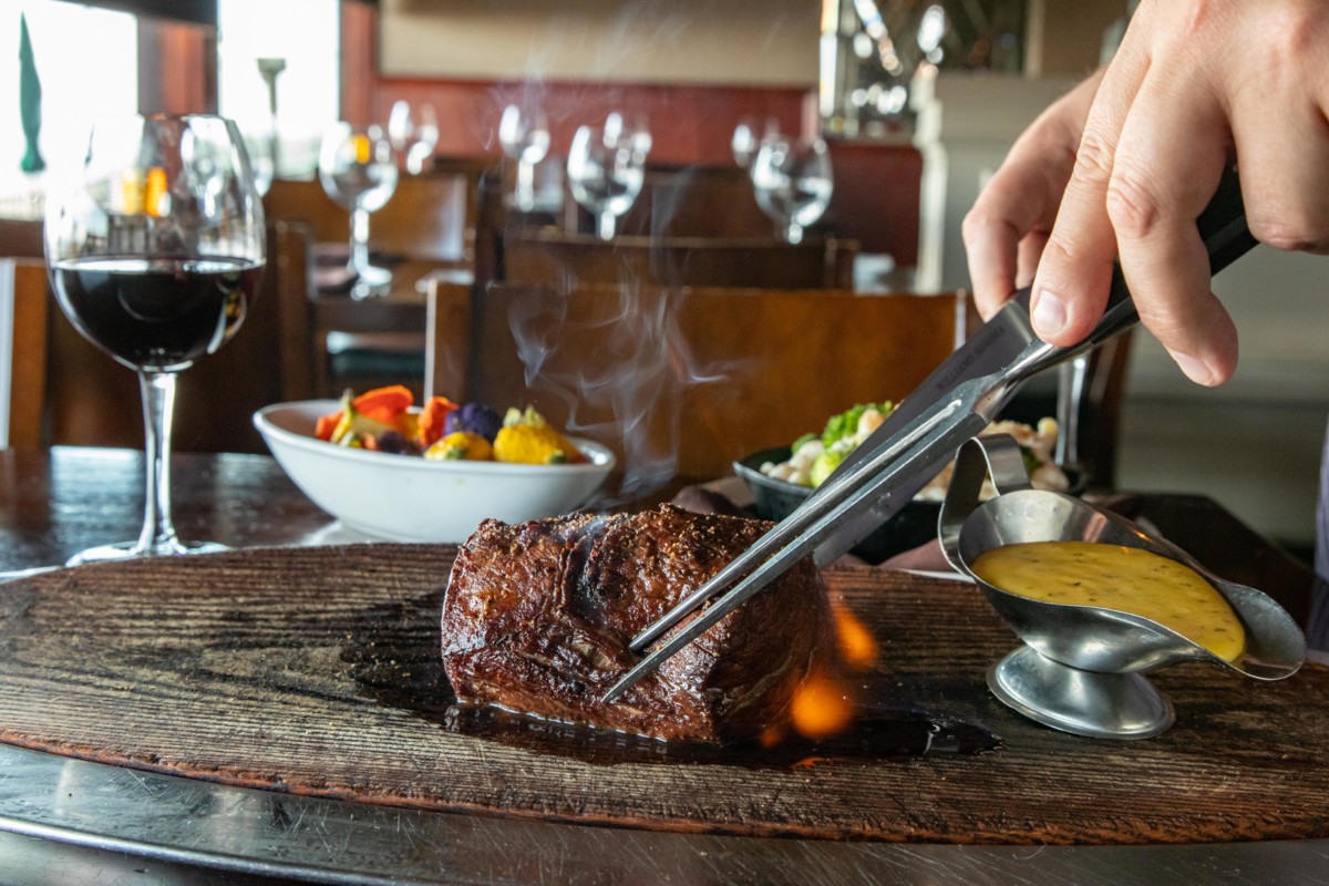 Specialty Restaurant Corp.'s myriad of venues have become known for upscale food offerings like steak and seafood (châteaubriand pictured).