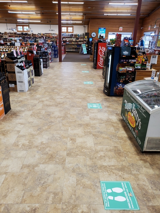 Social distancing measures are also being strictly enforced at Happy Harry's locations, with markings added to the floor noting where people can stand on line.