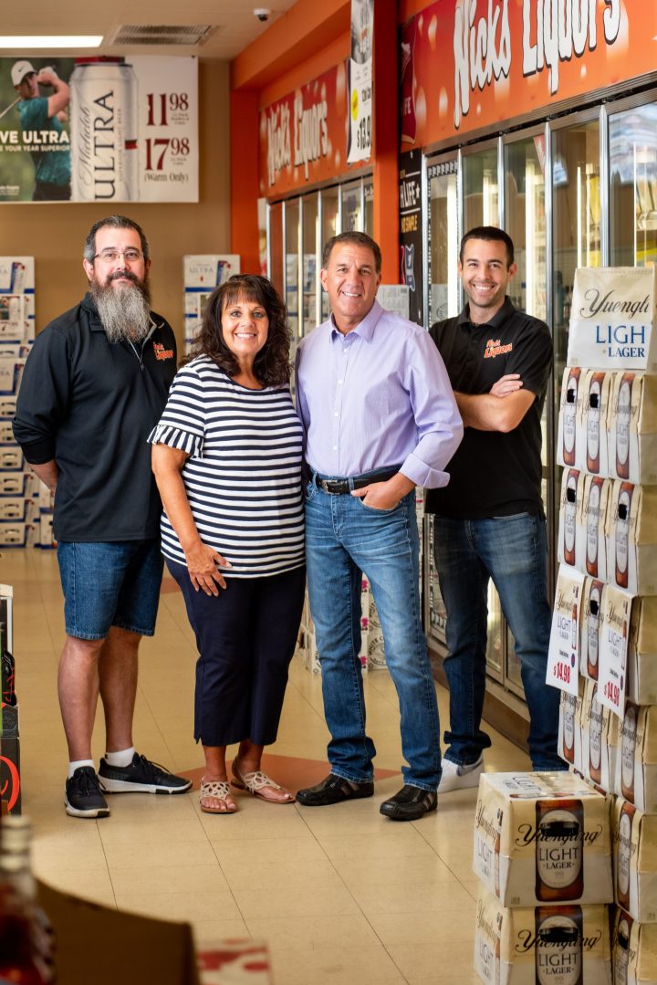 Founded in 1971 family-owned Nick’s Liquors (from left: general manager Larry Jarvis, co-owners and siblings Nick and Liz Kikalos, and Nick’s son, district manager Zachary Kikalos) has grown from a single store into one of suburban Chicago’s major retailers.