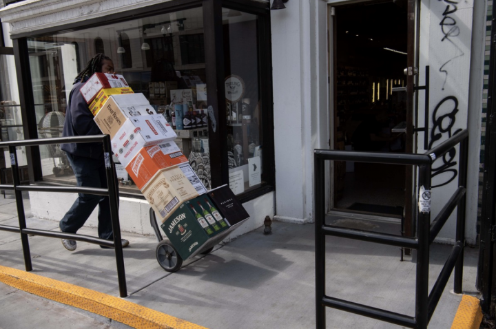 As crowds rushed to the off-premise, stores adapted by offering more delivery and curbside pickup (Washington D.C. spirits delivery pictured).