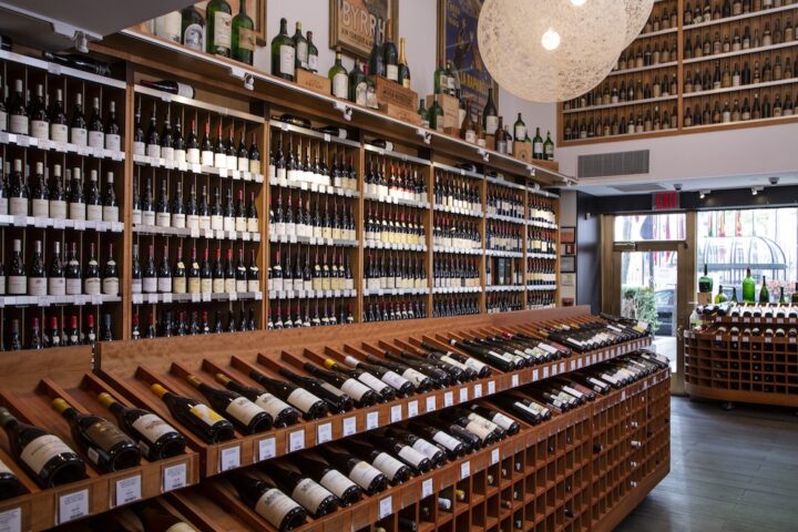 Morrell says his company is focused on its core business, which is selling higher-end wines (wine shelves pictured) and catering to collectors.