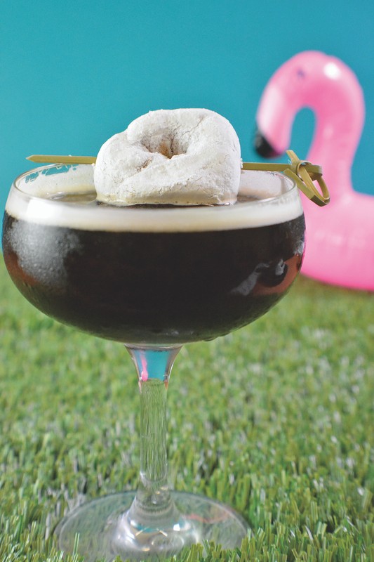 Datz's Dunk This Doughnut cocktail (pictured) mixes rye whiskey, espresso liqueur, black walnut bitters, and cold brew coffee, and is garnished with a powdered doughnut.