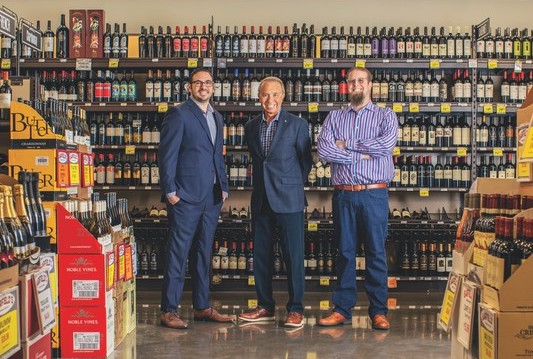 Garfield’s Beverage Warehouse has been a family-run business for 70 years. Second-generation owner Bruce Garfield (center) began working at the company when he was 13 years old. His son, David (right), is now CEO, working with COO Adam Silverstein (left) who has been with the company for nearly 20 years.