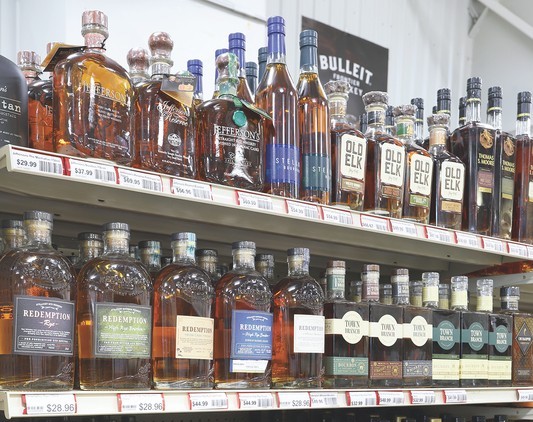 Long a tourist destination, Michigan has reaped the benefits of people traveling close to home due to Covid-19. The state benefitted, Gagliardi says, due to having stock of sought-after products like higher-end spirits (whiskey shelves pictured) available to visitors.