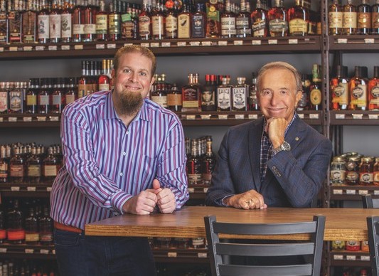 Father-and-son duo David (left) and Bruce Garfield have been working together for 20 years. David inherited Garfield’s Beverage from his father, Norman, and it remains a family affair today.