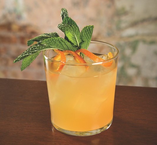 Dusek’s Tavern in Chicago sticks to a tried-and-true pairing of peach and Bourbon in the Daisy (pictured).