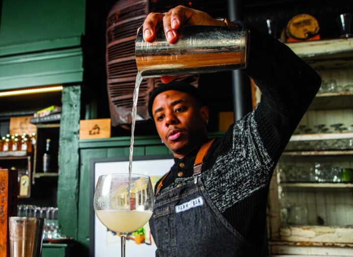 Farm Bar Lakeview beverage director Justin Young (pictured) plays with ingredients like sage, tomato, basil, blue cheese, and chamoy on the drinks menu.