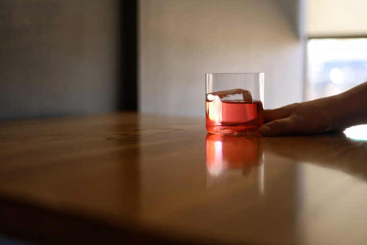 The Gloria blends lacto-fermented, strawberry-infused gin with bitter liqueur, grapefruit-infused Campari, grapefruit liqueur, strawberry oleo saccharum, and orange bitters.