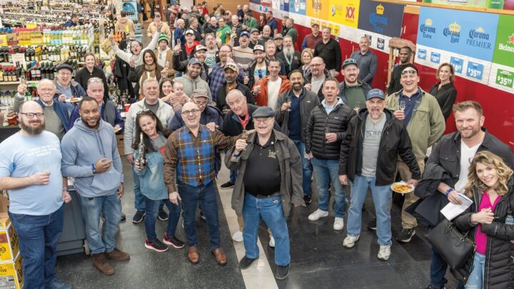 Julio’s owner Ryan Maloney (pictured center with Go! Whiskey Week 2025 tasting attendees) believes in a liquid-to-lips philosophy, allowing customers to try wines before they buy them. He’s been ramping up tastings since he took over the business in 2000.