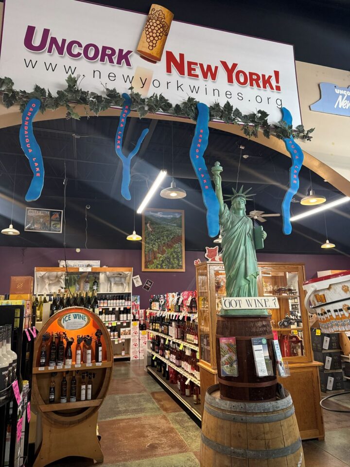 Bombace Wine & Spirits in Farmington, New York (pictured) stocks more than 475 SKUs of Empire State wines. Store owner Don Bombace says permitting wine sales in New York grocery stores would put many liquor stores in plazas with supermarkets out of business.