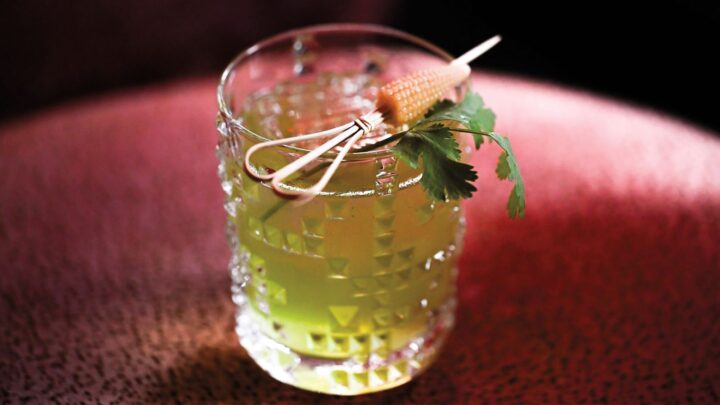 The Green Thumb cocktail (pictured) at Salon Salon at the Maison Métier hotel in New Orleans features Oxbow Small Batch White rum mixed with green melon and corn liqueurs, lime juice, house-made pineapple syrup, and fresh cilantro.