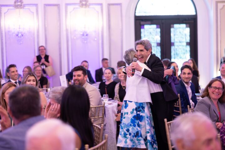 Gary Fisch (pictured), co-owner, Gary’s Wine & Marketplace, a three-unit New Jersey-based beverage alcohol retailer, gets a big hug from a participant while serving as event auctioneer at a fundraiser for JBWS, an organization serving abused people. This year, the auction raised more than $380,000 in seven minutes.