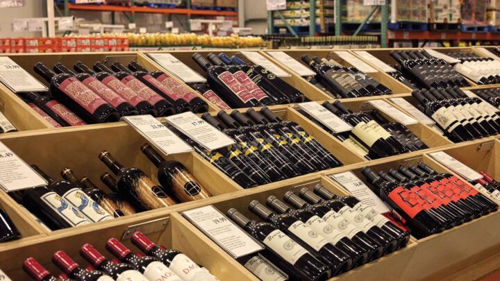 Wine makes up 50% of beverage alcohol sales at Costco (in-store wine display above). The stores offer an assortment of well-known brands, boutique finds, and proprietary wines.