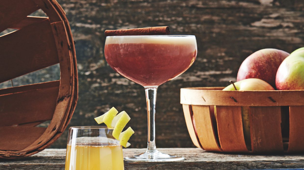 coupe glass with reddish whiskey cocktail