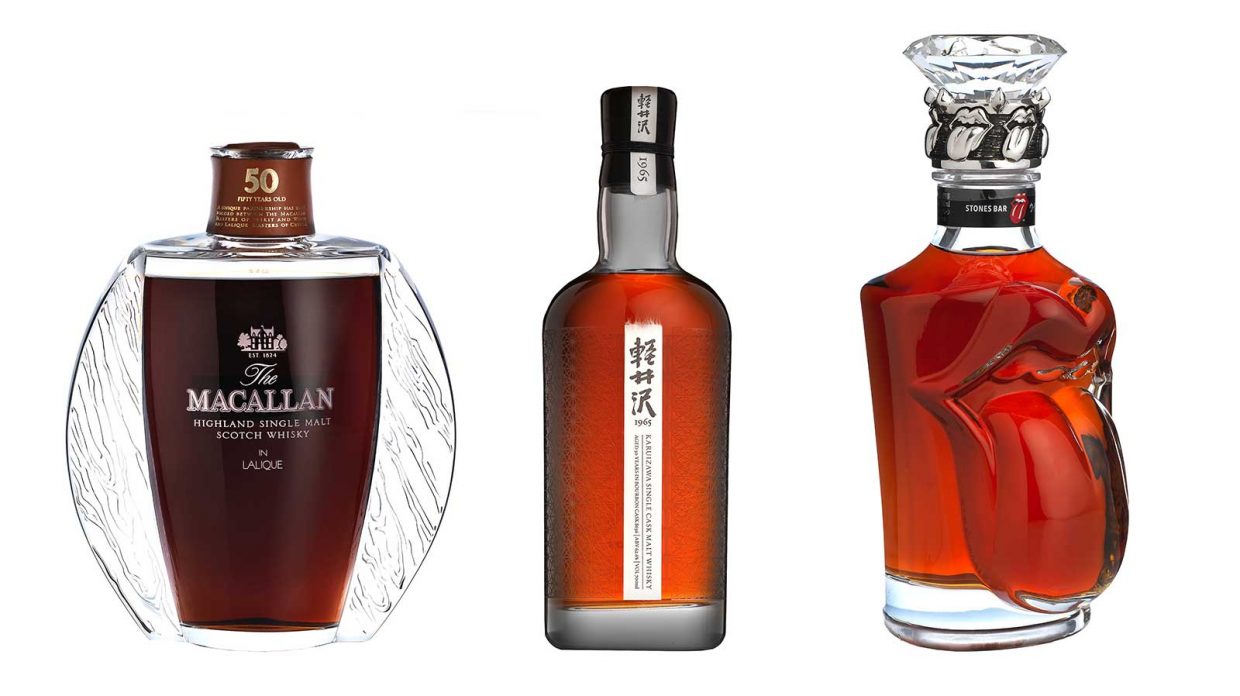 A lineup of Macallan in Lalique, old Karuizawa, and a Rolling Stones Suntory bottle