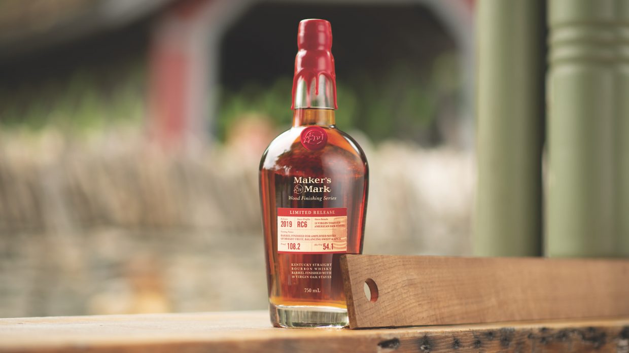 a bottle of maker's mark wood finished series 2019 release RC6 stave bourbon, with an oak stave