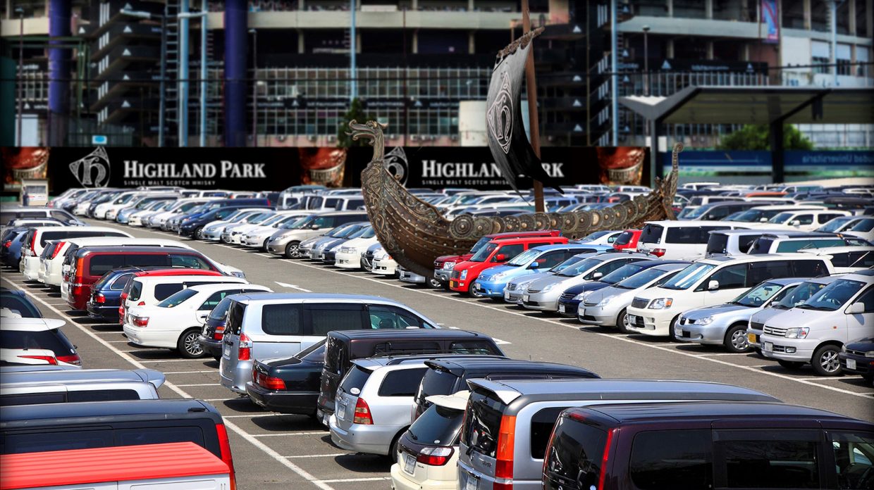 Photo of a Viking-themed tailgate ship parked in a football stadium parking lot; the so-called ship is part of what single malt scotch brand Highland Park is calling the ship-and-sip package they're launching in partnership with the NFL's Minnesota Vikings, billed as the ultimate football pre-game.