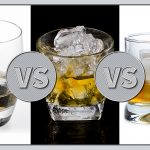 Three glasses—one with whiskey stones, one with crushed ice, and one with a large cube of ice.