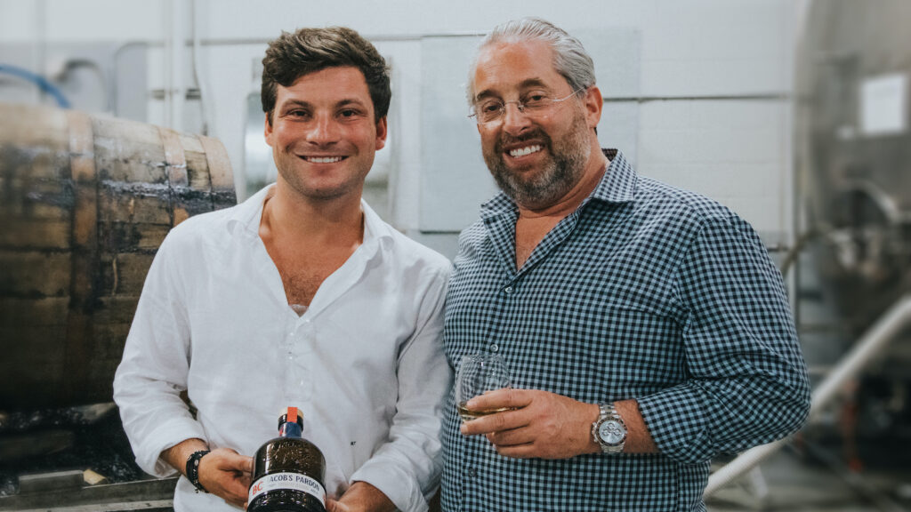 Jake Taub and father Marc Taub with the first bottle of Jacob's Pardon 8 year old Small Batch whiskey