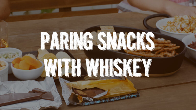 the words pairing snacks with whiskey atop an image of snacks