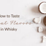 halved coconuts with the text "how to taste coconut flavors in whisky"
