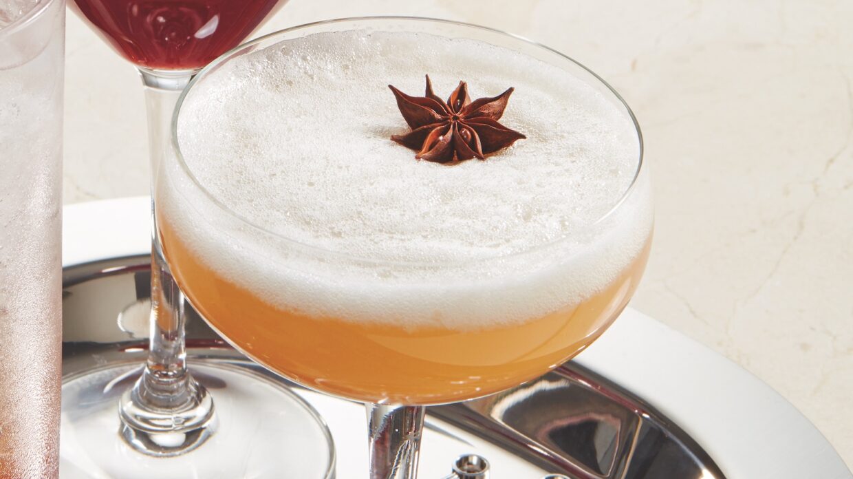 A whiskey cocktail with a star anise garnish